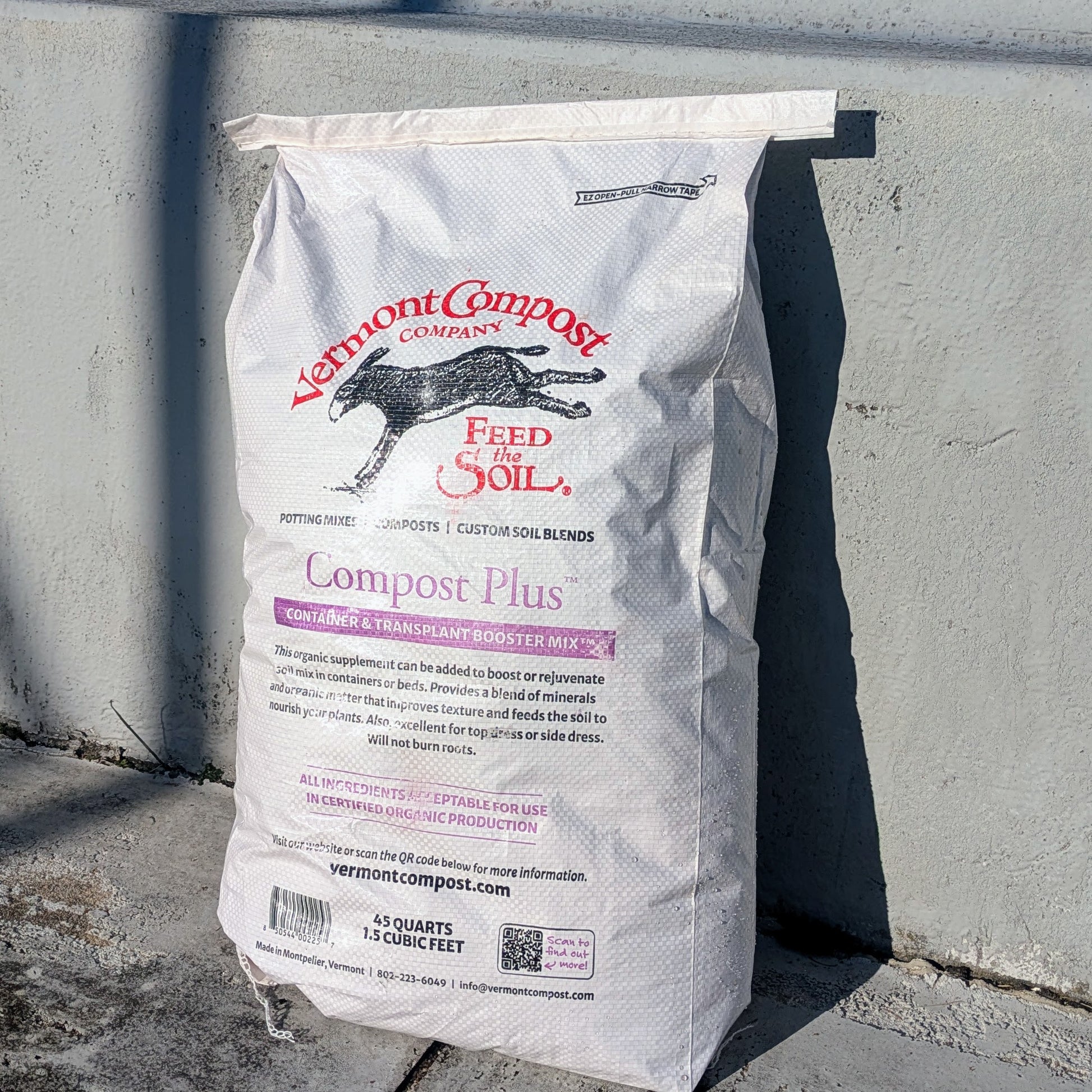 a white, 46 quart bag of Vermont Compost's Compost Plus 